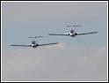 Two L-29 flying on formation over the airfield