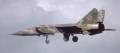 MiG-25 in flight with landing gear down.