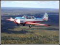 Yak-52 flying real close in formation