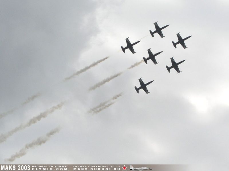 Six L-39 Albatroses with smoke.