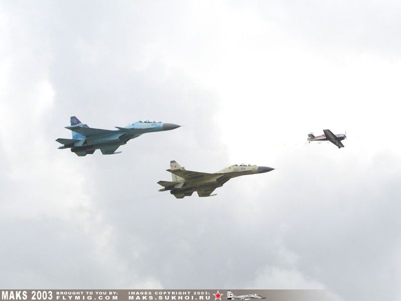 Su-27UB, Su-30MK and Su-26 in the air.
